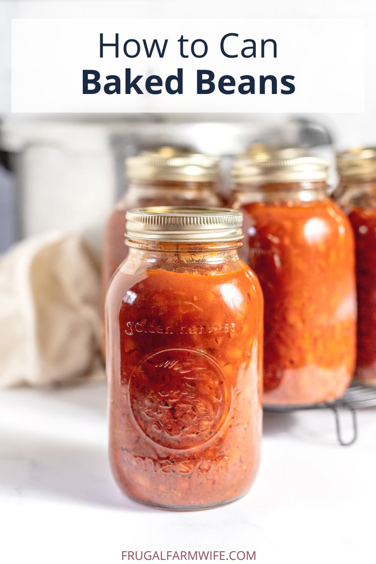 jars filled with baked beans sitting on top of a counter