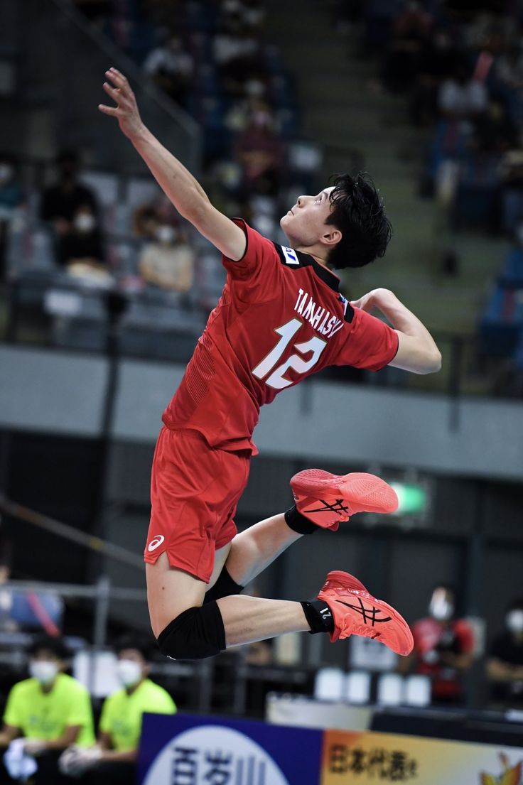 a man jumping up in the air to catch a frisbee