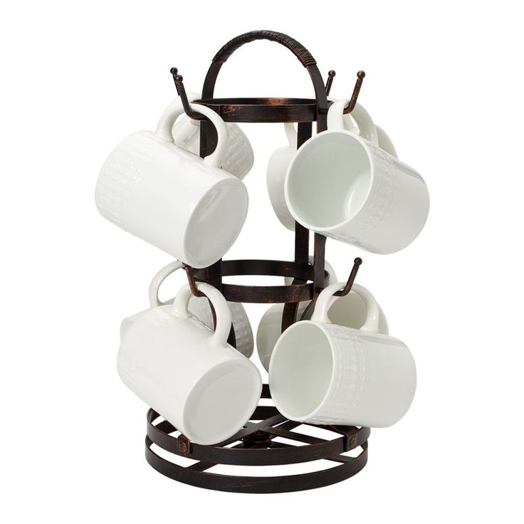 a stack of coffee mugs sitting on top of a metal rack with cups hanging from it's sides