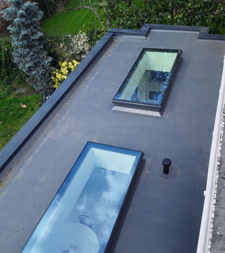 two skylights on the roof of a house