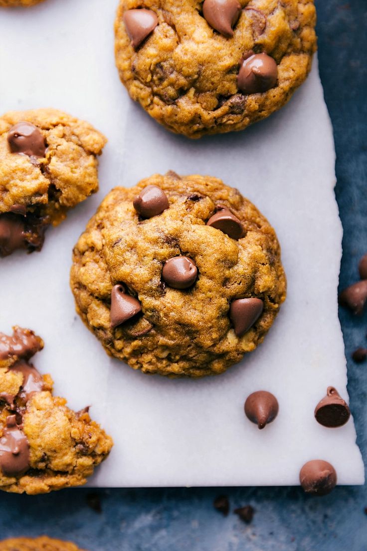 chocolate chip cookies on top of a piece of parchment paper