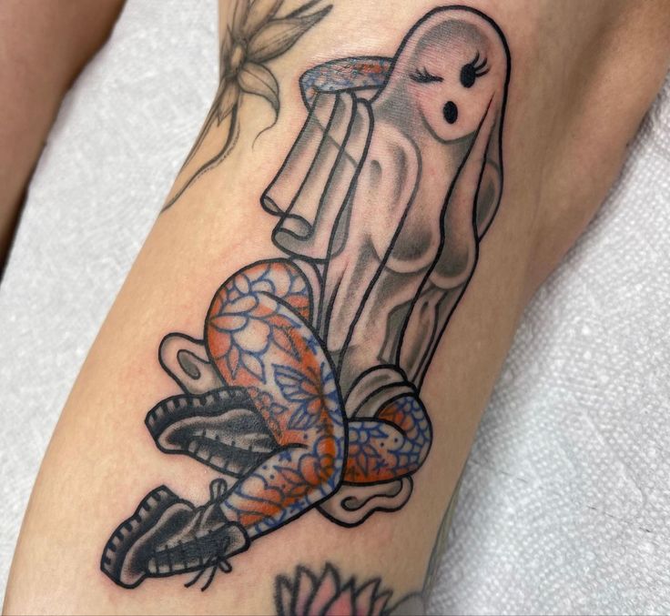 a woman's leg with a tattoo on it