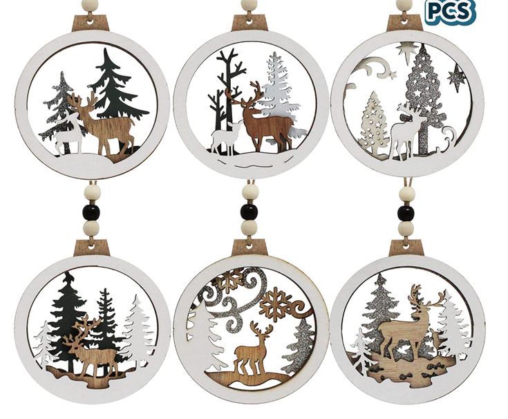 christmas ornaments with different designs and animals in the woods, including deer, pine trees, fir