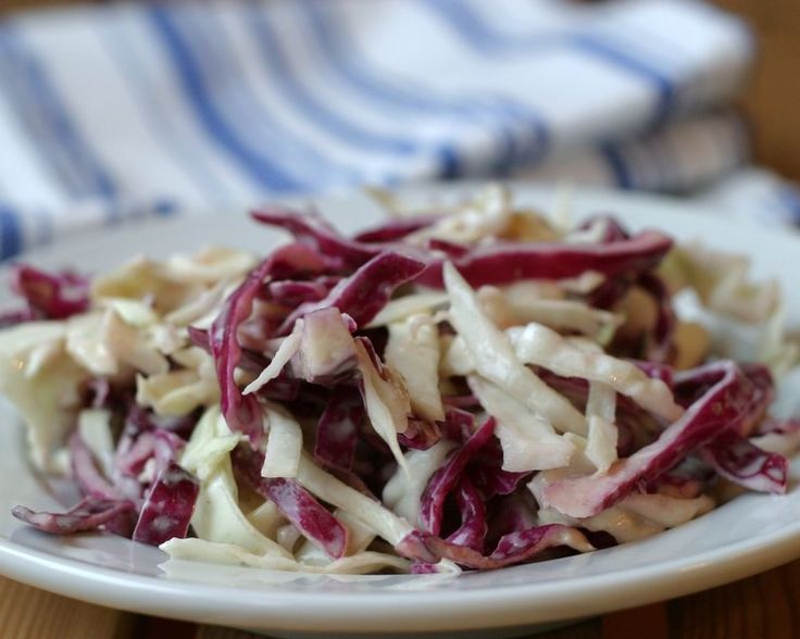 a white plate topped with shredded red cabbage