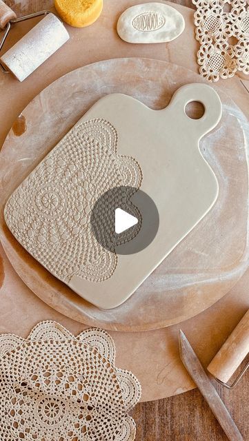 a cutting board that has some doily on it