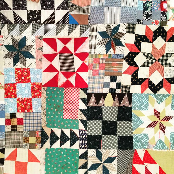 a quilt made with many different colors and patterns