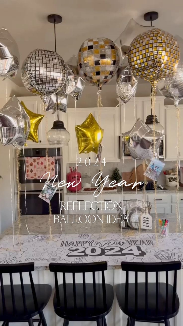 some balloons are hanging from the ceiling in a kitchen