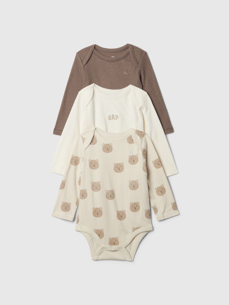 Soft knit bodysuits.  Crewneck.  Long sleeves.  Snaps at inseam for easy dressing and diapering.  Certain styles have lapped shoulders, allover prints, the Gap arch logo, or pockets at chest.  Embroidered Brannan Bear at chest.  Certain styles are made with 100% organically grown cotton, which is grown without the use of synthetic pesticides and fertilizers.  For more fit and sizing info, check out our Size Guide. Neutral Baby Outfits, Essentials For Newborn, Honest Baby Products, August Baby, Cotton Baby Clothes, Arch Logo, Neutral Baby Clothes, Newborn Babies