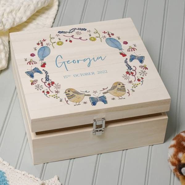 a personalized wooden box with two birds on it