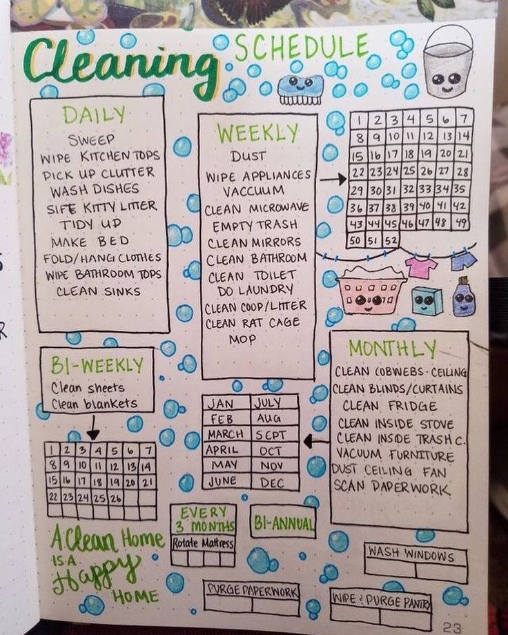 a hand holding up a planner with the words cleaning schedule on it