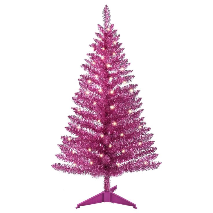 a pink christmas tree with lights on it