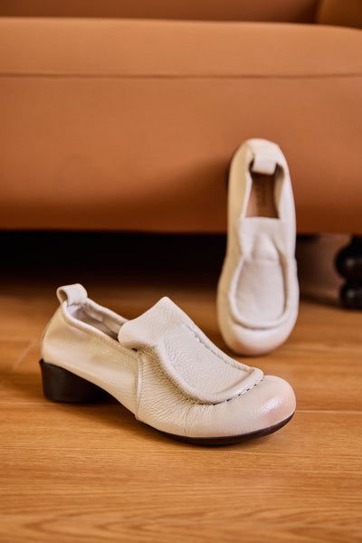 Chic Beige Almond Toe Slip-ons, Spring Workwear Slip-on Moccasins, Leather Slip-ons With Almond Toe For Fall, Cream Slip-on Flats For Office, Cream Leather Flat Slip-ons, Beige Low Heel Loafers For Spring, Comfortable Beige Flat Heel Loafers, Spring Chic Low Heel Leather Shoes, Chic Low Heel Leather Shoes For Spring