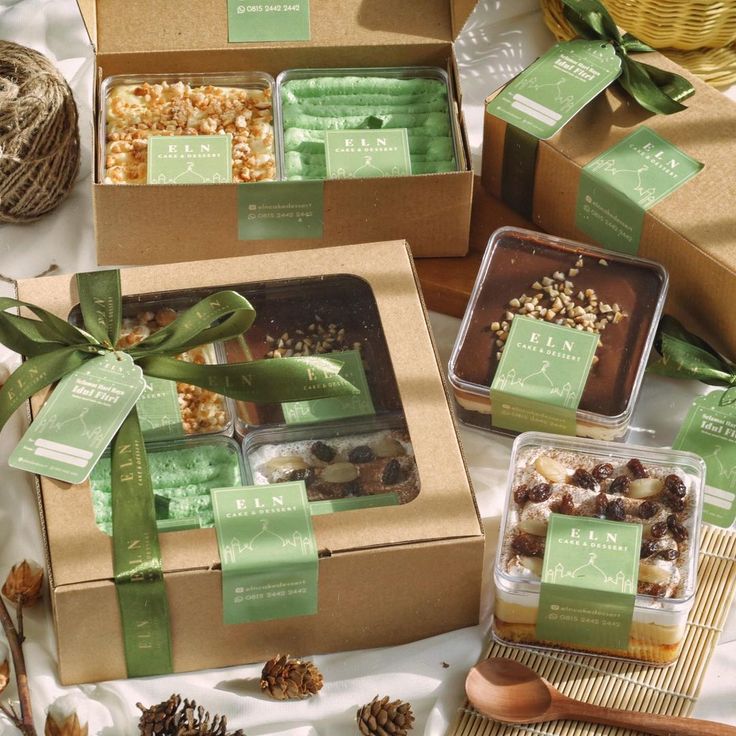 the boxes are filled with different types of treats and candies, along with pine cones