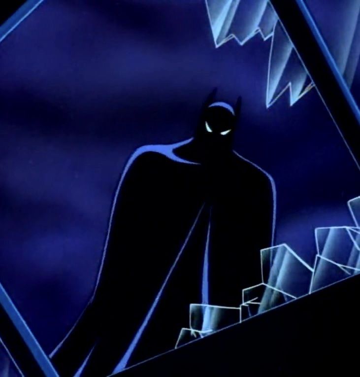 the animated batman is standing in front of stairs