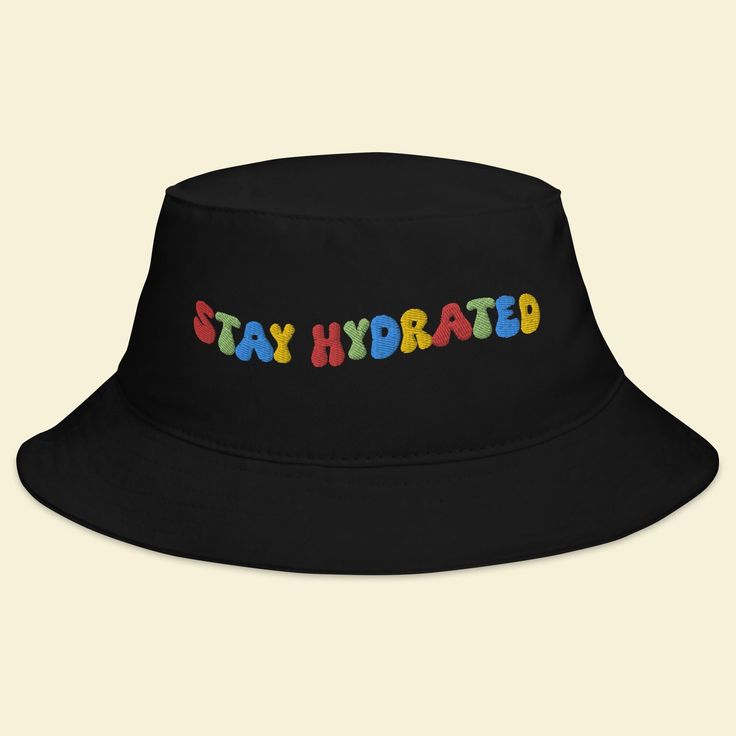 Keep the festival spirit alive with our "Stay Hydrated" Bucket Hat. This hat isn't just an accessory; it's a reminder to take care of yourself and spread positive vibes while you groove to the beats of EDM, Rave, and your favorite music festivals. 🎵 Key Features 🎵 Premium quality fabric for all-day comfort Unique design that promotes staying hydrated and positive vibes Trendy bucket hat style that adds flair to your festival attire One size fits most for convenient wear 🌈 Festival Vibes 🌈 Wh Affordable Cap For Music Festival, Adjustable Funky Bucket Hat, Retro Adjustable Hats For Festivals, Trendy Adjustable Black Bucket Hat, Trendy Festival Bucket Hat With Flat Brim, Trendy Bucket Hat For Music Festival, Trendy Bucket Hat With Flat Brim For Festivals, Adjustable Casual Bucket Hat For Music Festival, Retro Black Adjustable Bucket Hat