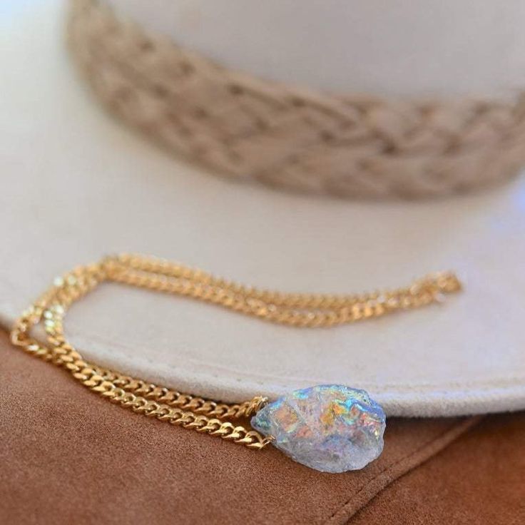 Angel aura quartz is a magical stone bringing you joy and optimism. This unicorn crystal is a high vibrational stone you want to take with you everywhere you go! Wear it, hold it, meditate with it and put it on your heart as you affirm your gratitude each day. Angel aura quartz crystal, approx 15mm x 20mm Gold plated curb chain 4mmx5mm Handmade in Arizona Necklace size guide Size 14" will typically be a choker style. Please use the size guide to confirm your length. Because all crystals & gemsto Aura Quartz Crystal, Obsidian Necklace, Magical Stones, Carnelian Necklace, High Vibrational, Angel Aura Quartz, Angel Aura, Meaningful Jewelry, The Lighthouse