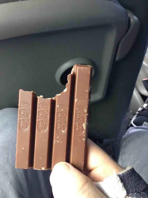 someone holding up a chocolate bar in their hand