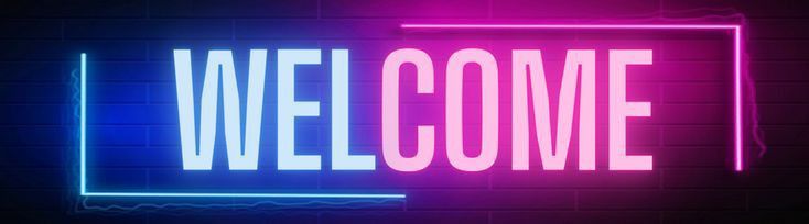 neon welcome sign on a brick wall