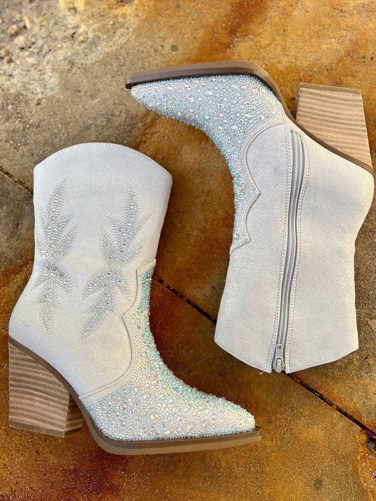 Add Glamour to any party with these "Lux" Grey Rhinestone Booties with front iridescent rhinestone detailing and side flared out feathered detailing. These booties have a Pointed Toe Silhouette, side zipper closure, 3" wooden block heel, 7" calf length from ankle to top of bootie. 10" total inches tall from sole to top of Bootie. These booties are made of a soft suede like material. Wooden Blocks, Soft Suede, Bootie, Side Zipper, Block Heels, Bootie Boots, Zipper, Heels, Boots