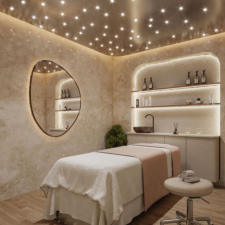 a spa room with lights on the ceiling and a large mirror above it that is lit up