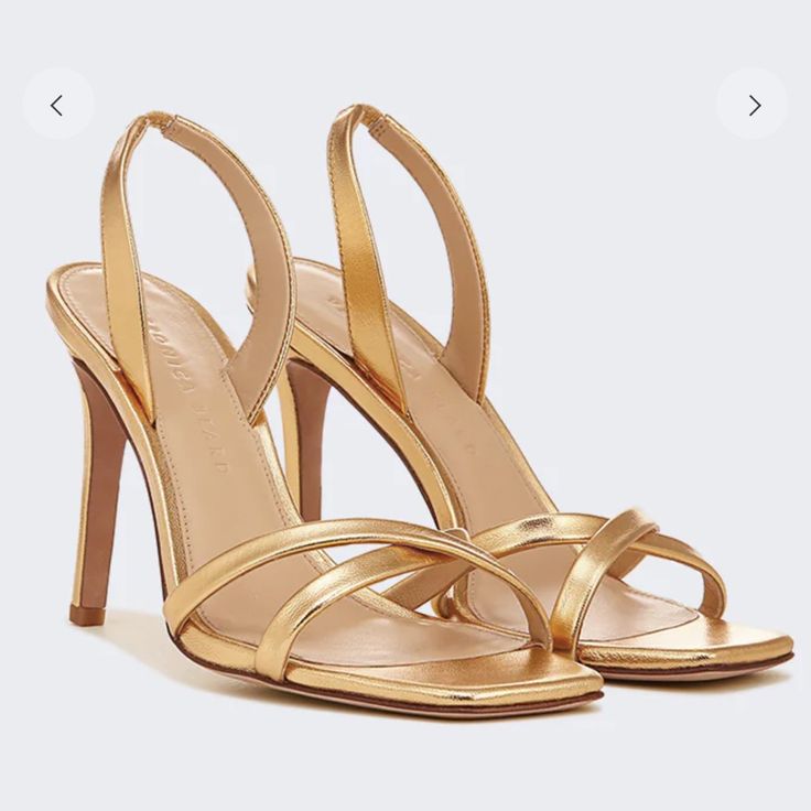 The Veronica Beard Analita Sandal In Gold Leather Features Crisscross Straps Along With A Stiletto Heel. Sling Back Style. Wear This Night-Out Ready Style With Everything From Dresses To Jeans. No Box Hug Comes With Logo Dust Bag. Brand New Never Worn. 100% Leather Heel Height 3 3/4" Gold High Heel Slingback Sandals With Padded Heel, Gold Slingback Sandals With Single Toe Strap For Evening, Gold Slingback Sandals With Single Toe Strap For Party, Gold Elegant Slingback Sandals With Single Toe Strap, Gold Evening Slingback Sandals With Single Toe Strap, Gold Slingback Pumps With Padded Heel, Gold Slingback Sandals With Wrapped Heel, Gold High Heel Leather Slingback Sandals, Gold Open Toe Slingback Sandals With 4-inch Heel