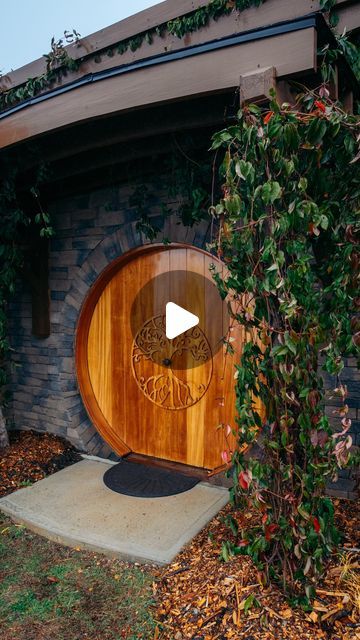 an image of a wooden door in front of a house with vines growing around it