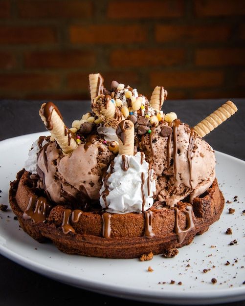 an ice cream sundae on a white plate