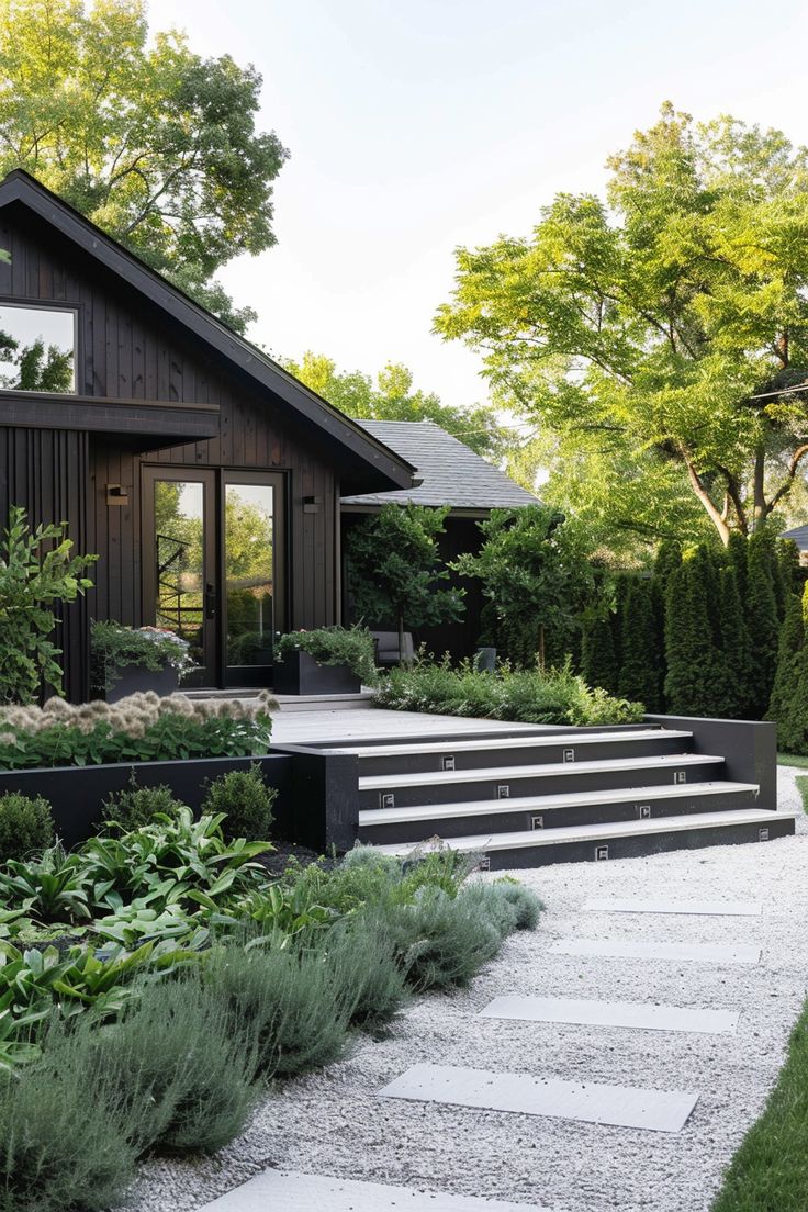 an outdoor garden with steps leading up to the house