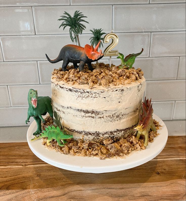 Dinosaur cake perfect for kids birthday 3rd Dinosaur Birthday Cake, Dinosaur Birthday Cake 3 Year, Dinosaur Three Rex Cake, Jurassic Park Cake Diy, 3 Rex Dinosaur Cake, Dinofour Birthday Cake, Homemade Dino Cake, Easy Dinosaur Birthday Cake, Roar Im 4 Birthday Cake