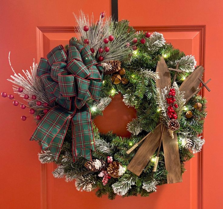 a christmas wreath hanging on the front door