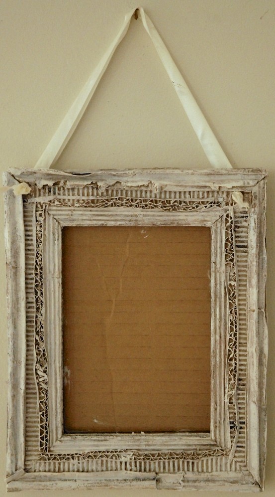 an old photo frame hanging on the wall