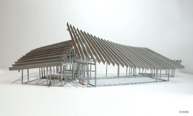 an architectural model of a building made out of metal rods and wood planks on a white background