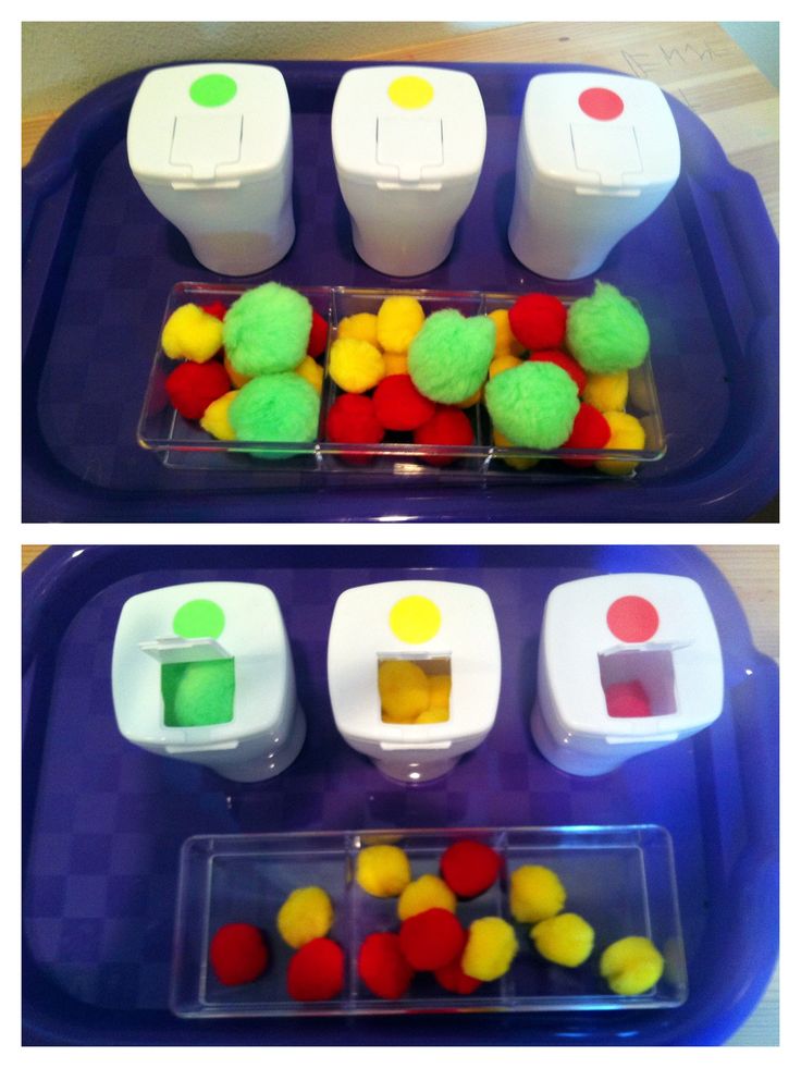 there are two trays with different colored balls in them and one is filled with gummy bears