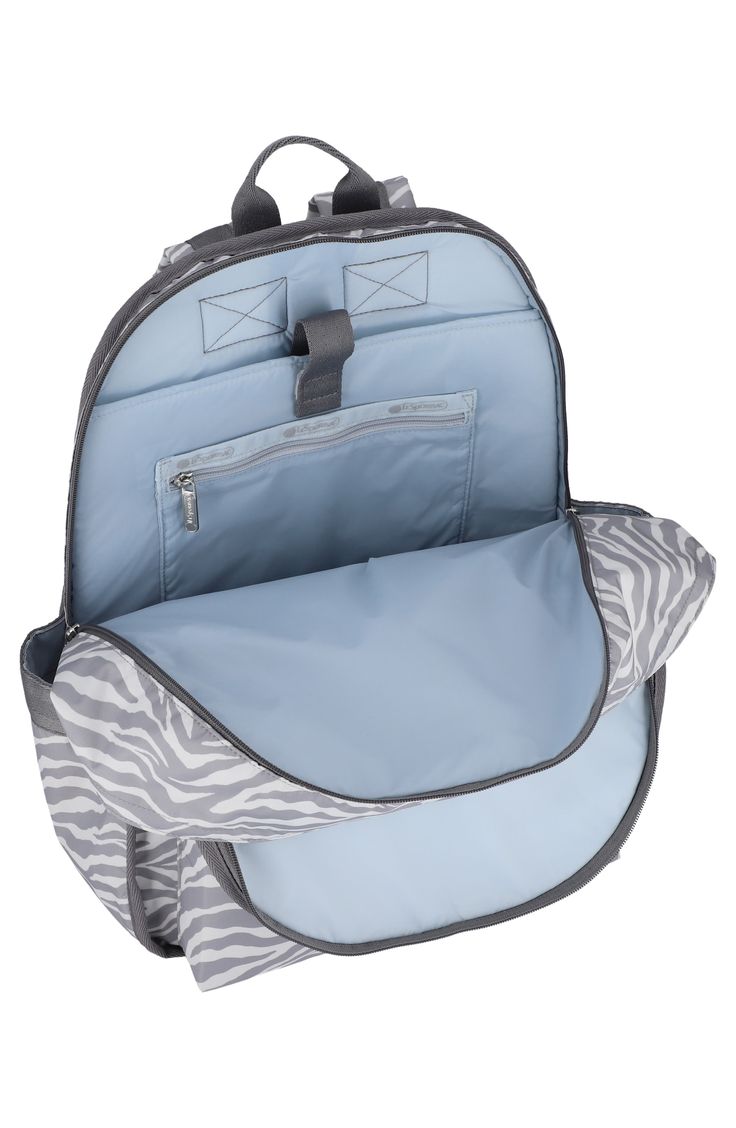 Dual compartments and extra pockets create a ton of room in an everyday backpack that secures your belongings in style. 16.1"H x 13"W x 4.9"D Top zip closure Textile Imported Casual Backpack Diaper Bag With Zipper Pocket, Casual Backpack Diaper Bag, Casual Diaper Backpack With Zipper Pocket, Casual Softback Diaper Bag For Travel, Casual Backpack Travel Accessories For Trip, Back To School Travel Backpack With Adjustable Straps, Softback Backpack With Anti-theft Pocket For On-the-go, Trip Backpack Luggage With Zipper Pocket, Backpack Luggage With Zipper Pocket For Trips