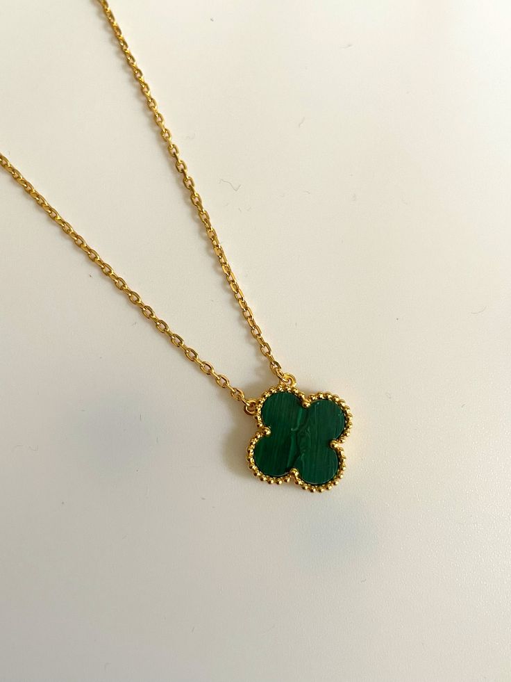 Green Clover Necklace, Clover Necklace Gold, Elegant Metal Necklaces With Flower Shape, Chic Green Jewelry For Gifts, Gold Flower-shaped Evening Jewelry, Gold Flower-shaped Jewelry For Evening, Gold Flower Shaped Evening Jewelry, Elegant Tarnish Resistant Flower-shaped Necklaces, Elegant Tarnish-resistant Flower-shaped Necklace