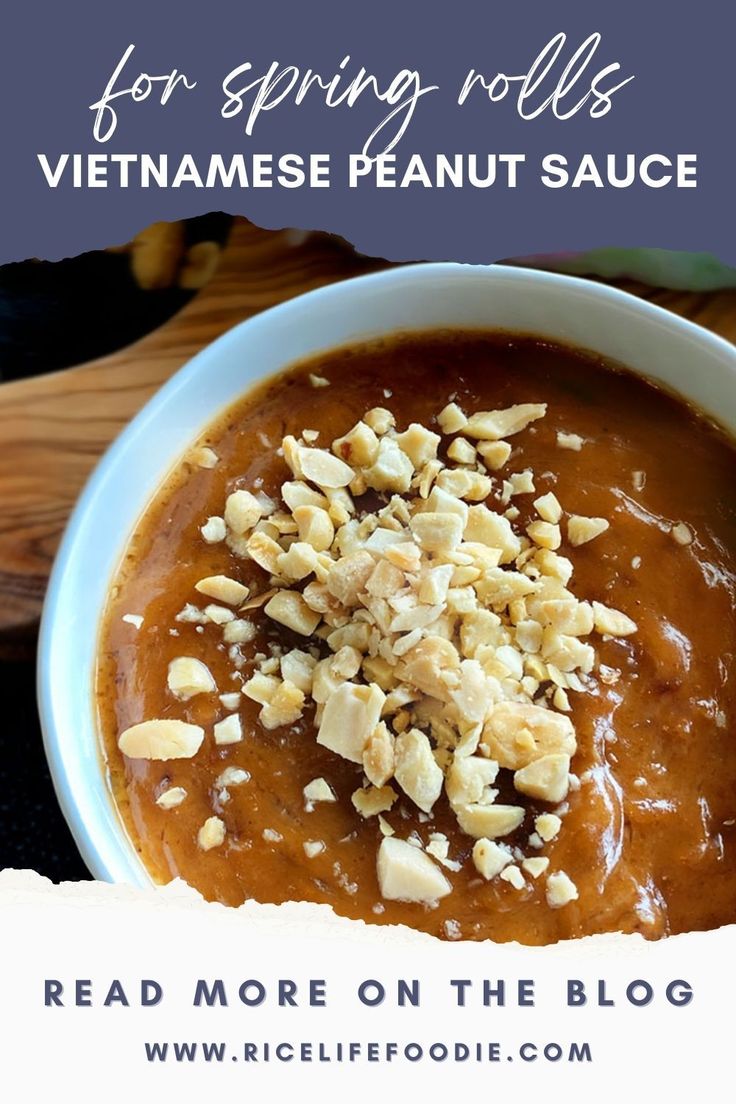 a bowl filled with peanut sauce on top of a table