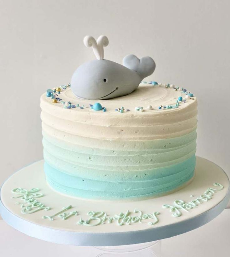 a birthday cake with a whale on top