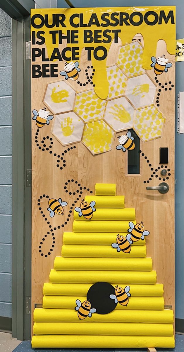 a classroom door decorated with bees and the words our classroom is the best place to bee