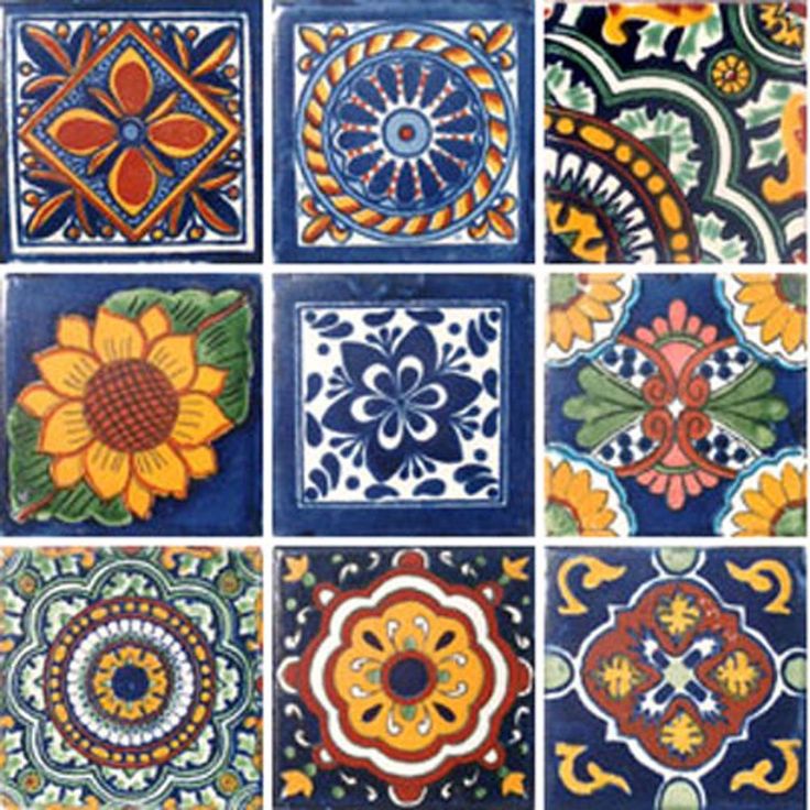 many colorful tiles with different designs and colors on them, including sunflowers in the center