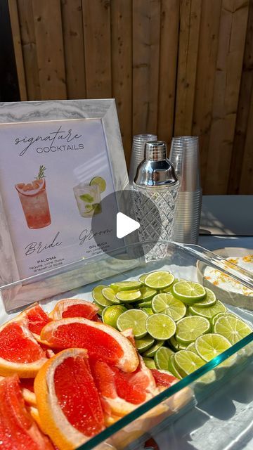 a glass tray filled with sliced oranges and limes