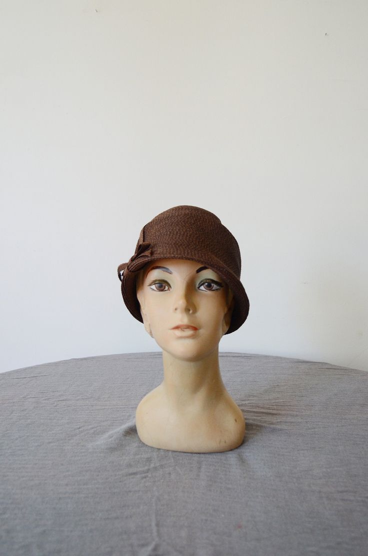 "A dark brown hat meant to look like a riding helmet. Label is Danciger. Excellent shape! Just fits around the crown of a 22\" head but would be a little less snug on smaller and fit farther down the head as shown. Follow along on instagram @lovecharlesvintage" Fitted Brown Hat For Kentucky Derby, Fitted Vintage Brown Fedora, Brimmed Brown Hats, One Size, Brown Cloche Hat With Short Brim, Retro Brown Wide Brim Fedora, Brown Brimmed Hat, Adjustable Brown Hats And Headpieces For Kentucky Derby, Adjustable Brown Cloche Hat For Kentucky Derby, Adjustable Brown Costume Hats For Kentucky Derby