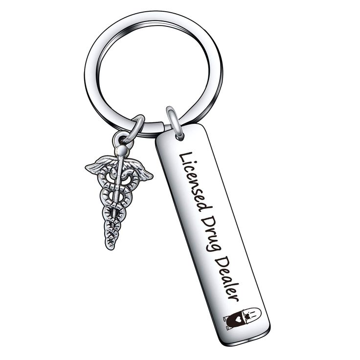 a metal keychain with an engraved medical symbol on the front and back side