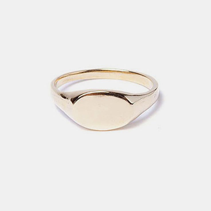 We love the vintage style of this dainty signet ring! Can be worn on it's own, stacked with other rings, or even taken to be engraved with something extra special. Dainty 14k Gold Stamped Signet Ring, Vintage Stackable Jewelry With Round Band, Classic Oval Stackable Jewelry, Vintage Yellow Gold Midi Rings For Wedding, Dainty Stackable Signet Ring With Round Band, Dainty 14k Stamped Signet Ring For Everyday, Engraved Signet Ring For Everyday Wear, Dainty 14k Gold Stackable Signet Ring, Dainty Everyday 14k Stamped Signet Ring