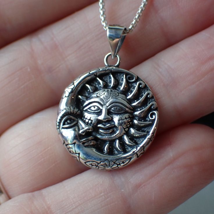 This is a very beautiful sterling silver celestial charm with a detailed sun and moon. It measures 1.1” long including the bail and .8" wide. This charm is photographed on a 1 mm sterling silver rounded box chain which is sold separately. It can be found here. Celestial Sun And Moon Sterling Silver Necklace, Sterling Silver Sun And Moon Spiritual Necklace, Sterling Silver Spiritual Necklace With Sun And Moon Design, Spiritual Sterling Silver Necklace With Sun And Moon Design, Spiritual Sterling Silver Sun And Moon Necklace, Sterling Silver Sun And Moon Round Necklace, Sterling Silver Round Necklace With Sun And Moon Design, Sterling Silver Sun And Moon Jewelry, Sterling Silver Jewelry With Sun And Moon Design