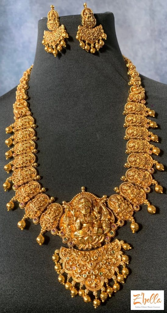 Long Lakshmi Necklace With Earring Necklace Yellow Gold Jewelry For Puja And Festivals, Yellow Gold Jewelry For Puja Diwali, Yellow Gold Jewelry For Diwali Puja, Yellow Gold Chandbali Jewelry For Puja, 22k Gold Meenakari Jewelry For Puja, 22k Gold Temple Jewelry As A Gift, 22k Gold Temple Jewelry For Gifts, 22k Gold Temple Jewelry Gift, 22k Gold Chandbali Jewelry For Puja