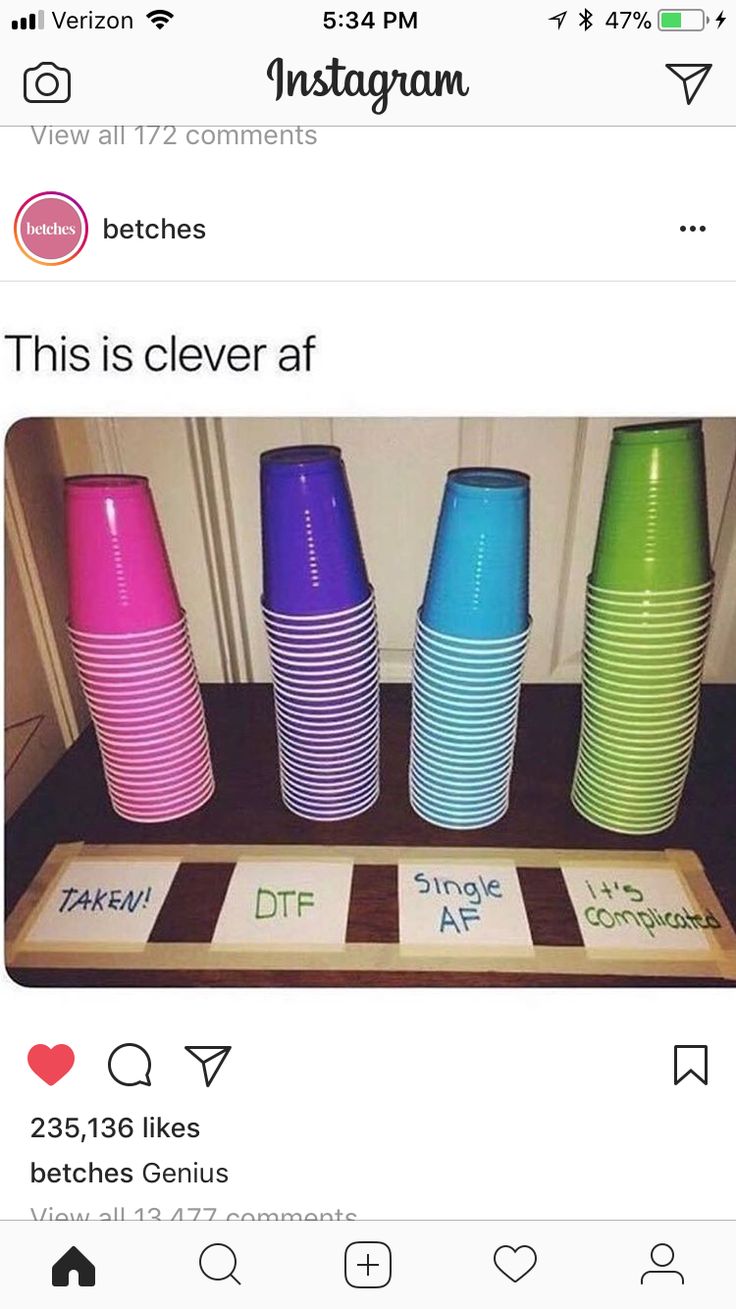 a group of colorful cups sitting on top of a counter