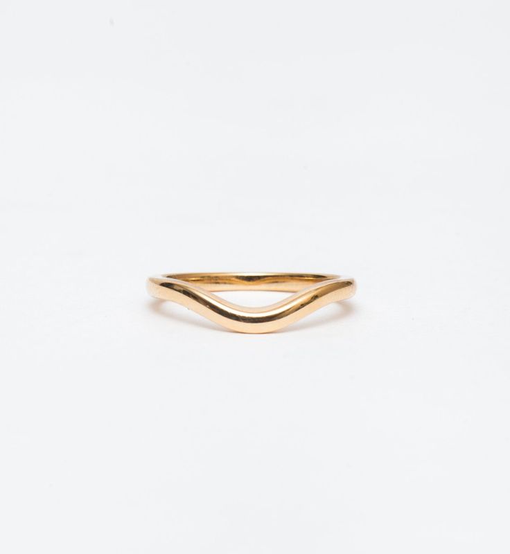 Simple and elegant, the polished form of this curved gold band makes a perfect complement to all of Single Stone's signature engagement rings. The gentle contour delicately traces around solitaires, halos, and geometric settings alike. You can even wear it in multiples or as a matched pair for even more stacking options. Made in the U.S.A. Measures 2.0 mm wide. Also available in DIAMOND. All sizes available by special order in 4-6 weeks. To inquire, including requests for alternate metal options Single Stone, Gold Band, Gold Bands, Halo, Fashion Beauty, Fine Jewelry, Engagement Rings, Band, Stone