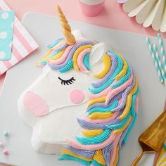 a cake decorated like a unicorn on top of a table