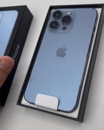 someone is holding an iphone 11 in their hand and it's inside the box