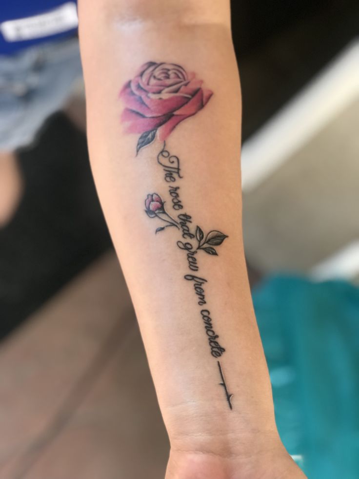 a woman's arm with a rose and the words, love is in the air